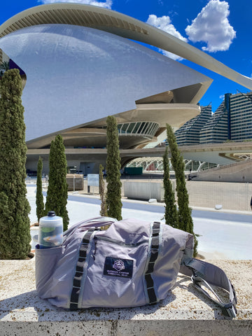 OCE GEAR packable travel tote bag in a park in Spain with lightweight travel gear