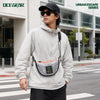 Urban commuter wearing OCE GEAR Cloud Shadow Half Moon Bag in city scene
