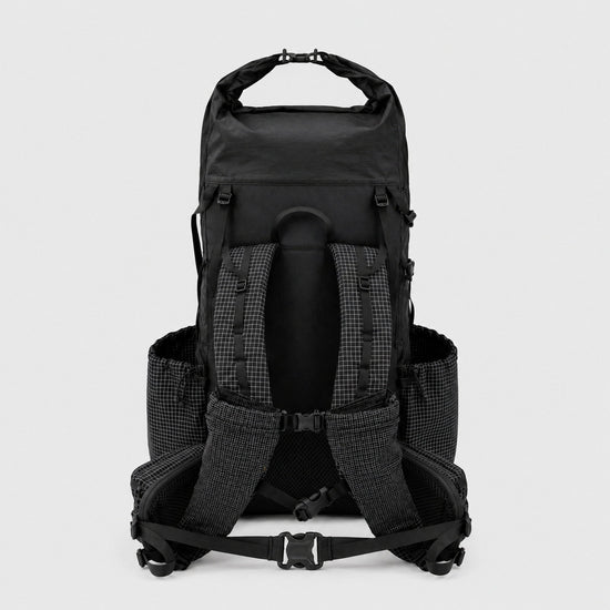 Back view of OCE GEAR 55L roll-top backpack with padded shoulder straps and hip belt
