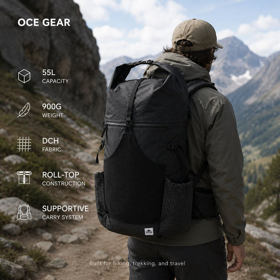 Hiker wearing OCE GEAR 55L roll-top backpack on a mountain trail