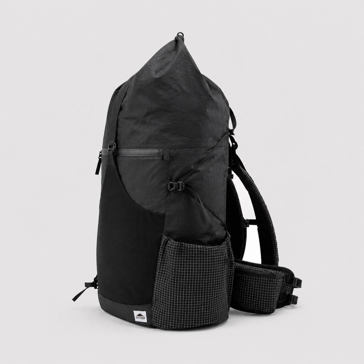 Side view of black roll-top hiking backpack with side pocket and adjustable gear cords