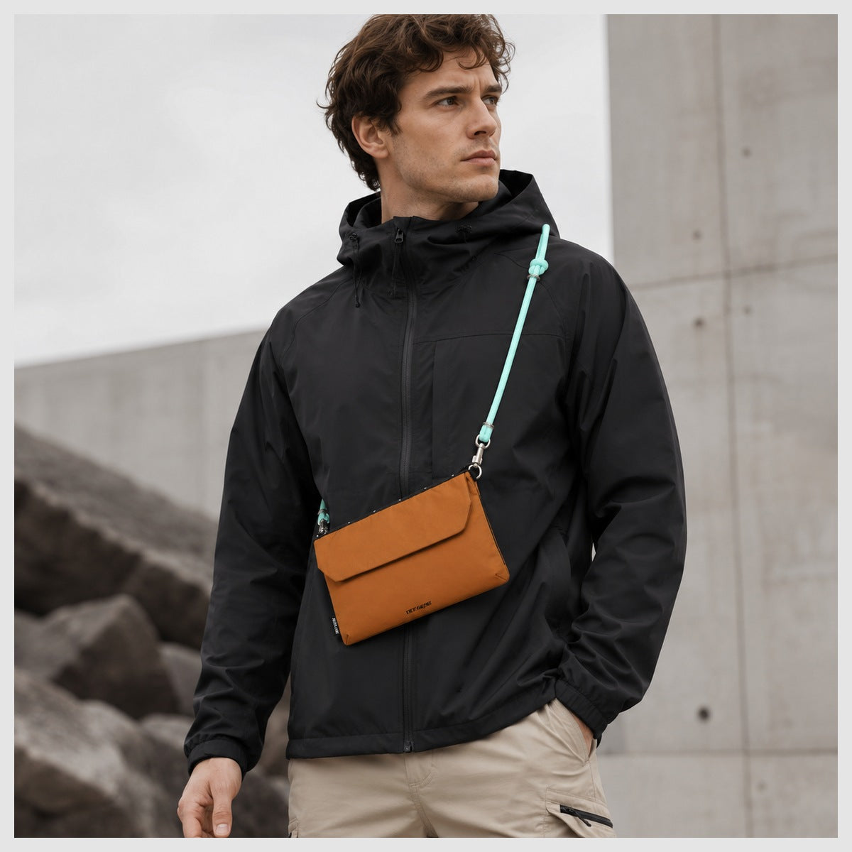 Model wearing OCE GEAR Trail Orange crossbody organizer bag for urban outdoor use