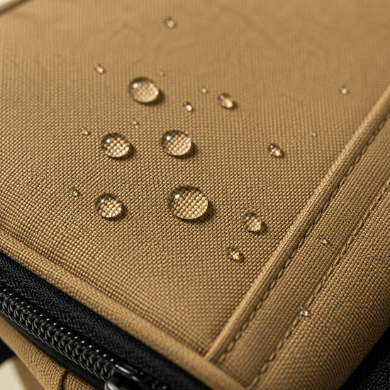 Close-up of water-repellent 1000D khaki fabric with water droplets