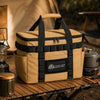 Khaki camping storage bag on outdoor camp table with cookware and lantern