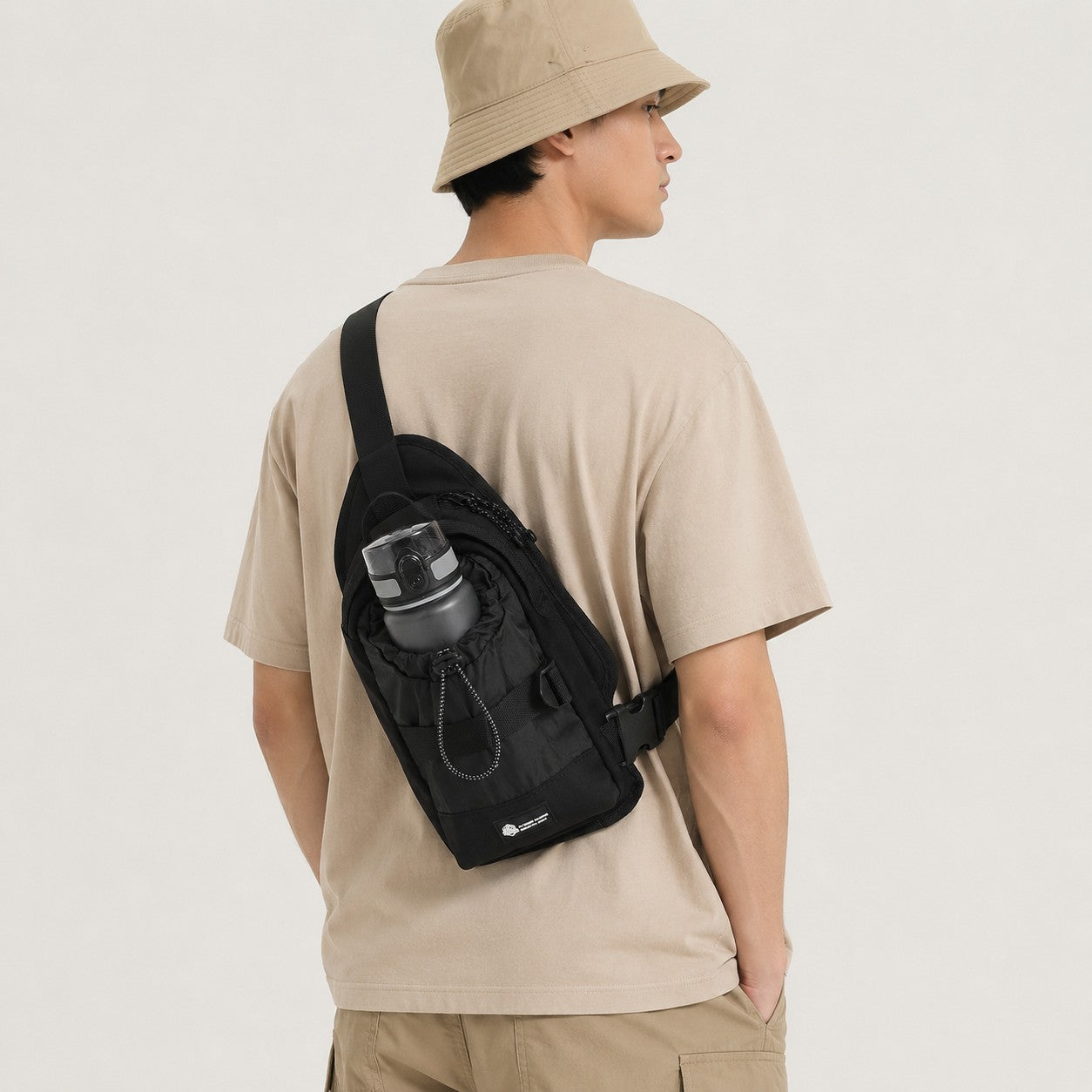 OCE GEAR black bottle sling bag worn crossbody