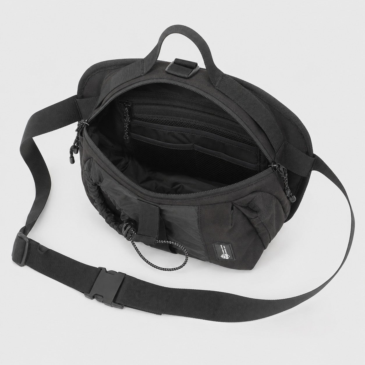 Internal organizer space inside compact bottle sling bag