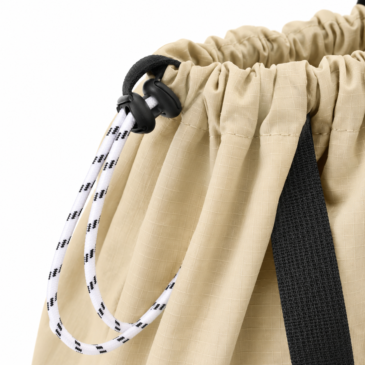 Drawstring closure and ripstop nylon fabric detail on tote bag