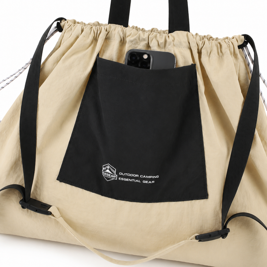 Front pocket detail on packable drawstring tote bag