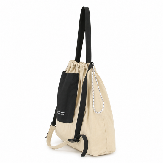 Packable drawstring tote bag side view with adjustable straps