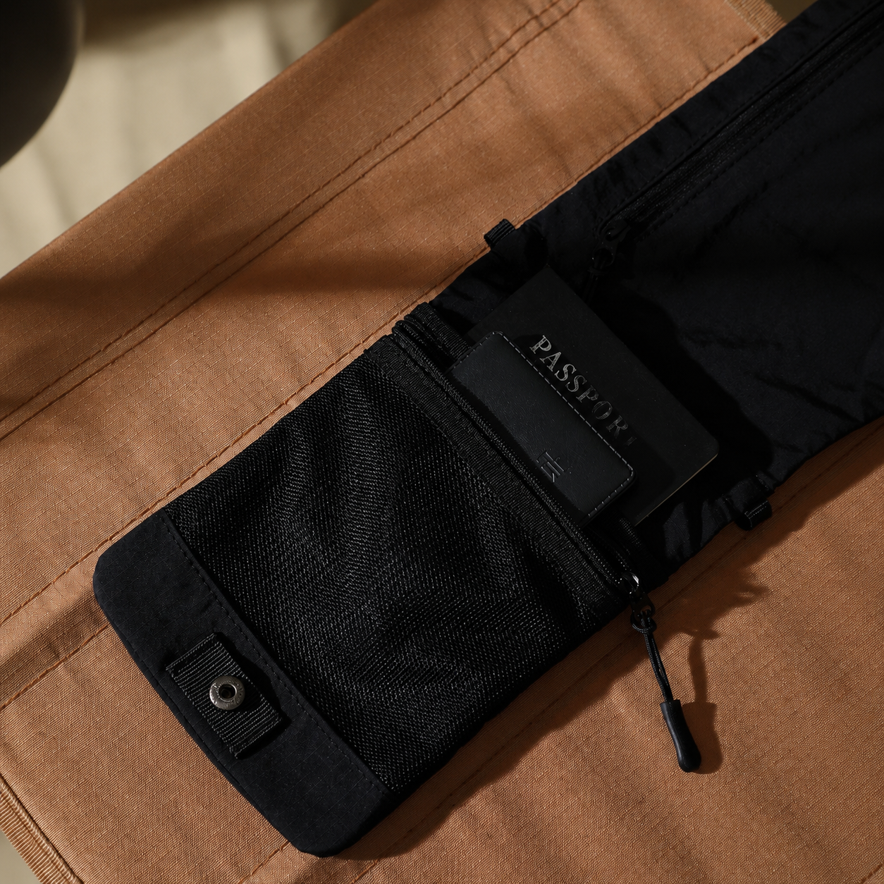 RFID pocket detail on travel phone pouch with passport