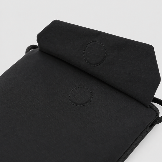 Protective flap detail on RFID travel phone sacoche pouch