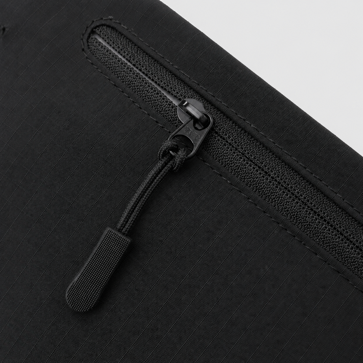 Zipper detail on matte nylon ripstop RFID phone pouch