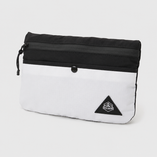Travel tote bag folded into compact detachable mini pouch