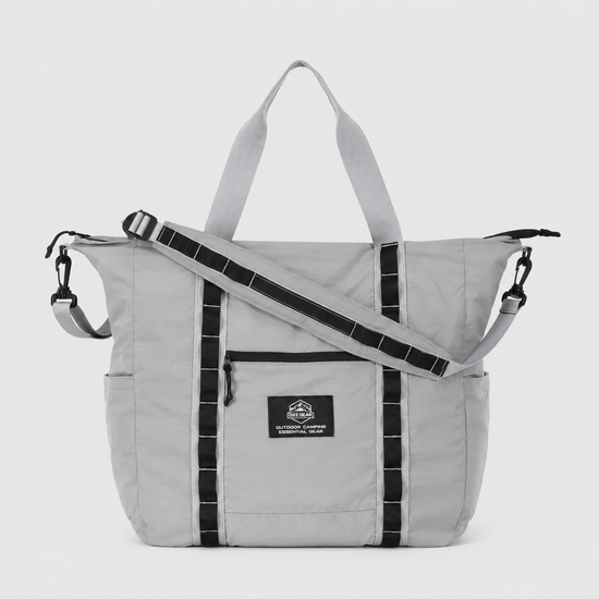 Gray packable duffel tote with detachable shoulder strap