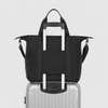 Packable travel tote bag mounted on suitcase handle with luggage sleeve