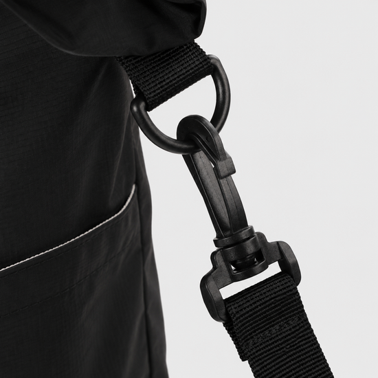 Rotating quick release clip detail on packable travel tote bag