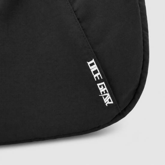 OCE GEAR logo detail on black expandable crescent shoulder bag