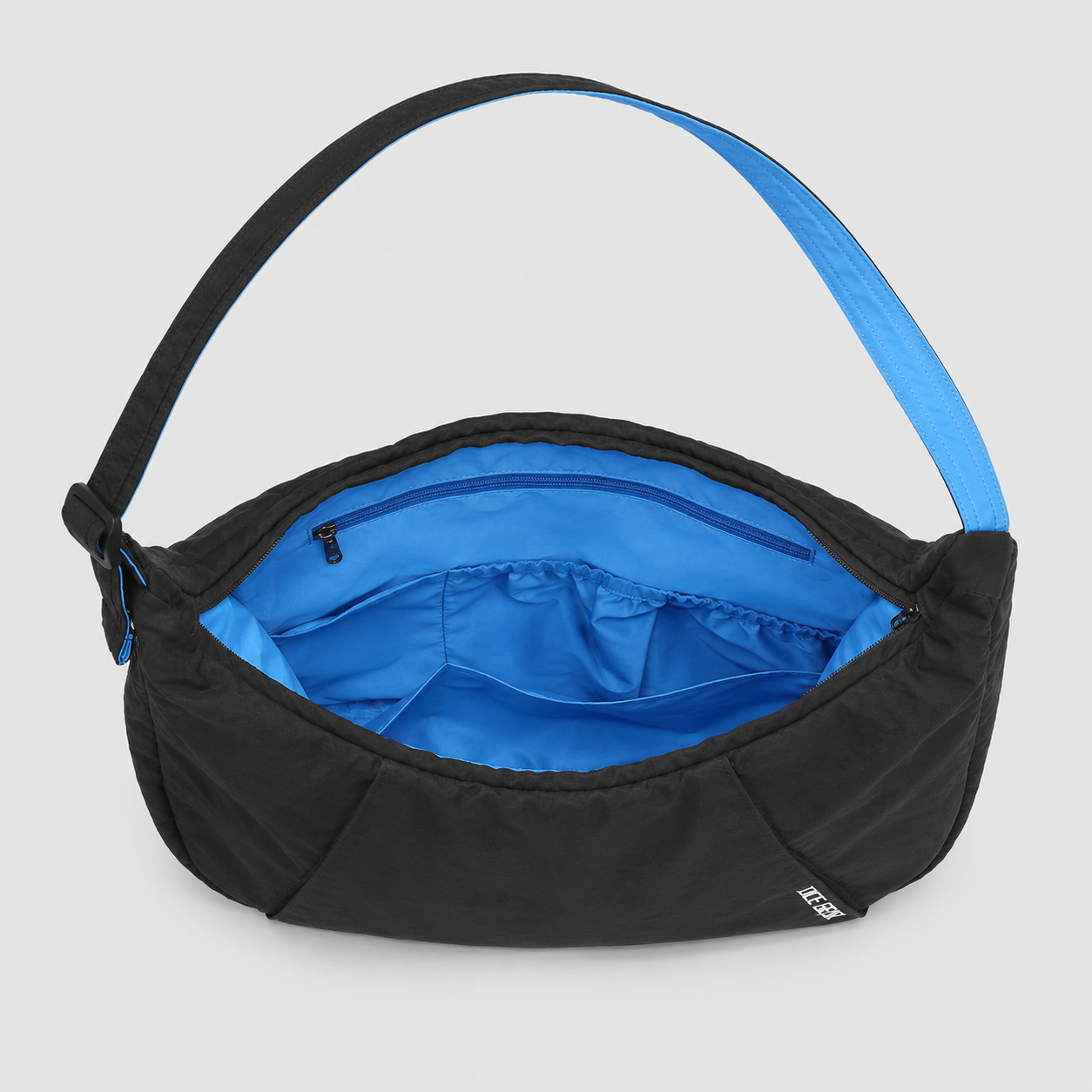 Large crescent shoulder bag with blue contrast lining